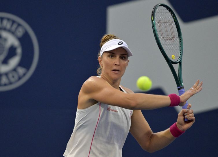 Jul 29, 2025; Montreal, QC, Canada; Beatriz Haddad Maia (BRA) returns the ball against Suzan Lamens (NED) in second round play at IGA Stadium. Mandatory Credit: Eric Bolte-Imagn Images