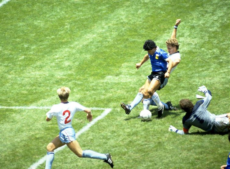 FILE PHOTO: Football - 1986 FIFA World Cup - Quarter Final - England v  Argentina - Azteca Stadium, Mexico City - 22/6/86   Diego Maradona scores for Argentina.  Mandatory Credit: Action Images / Juha Tamminen/File Photo
